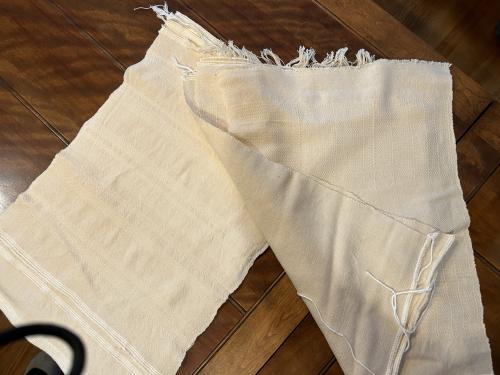 Barbara’s newest warp of natural cotton in twill and plain weave.  It’s good to weaving again! 
