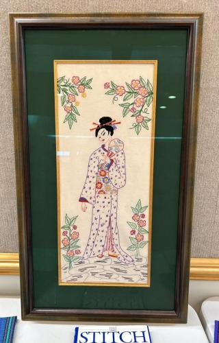 Jan's hand embroidered picture .completed when she was about 8